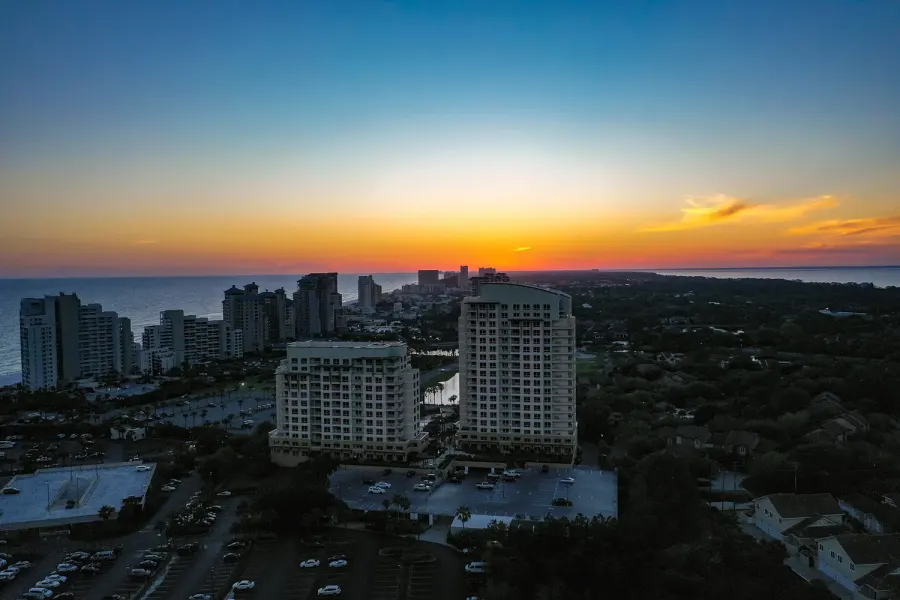 Aerial view of Destin high-rise condo towers along the gulf at dusk