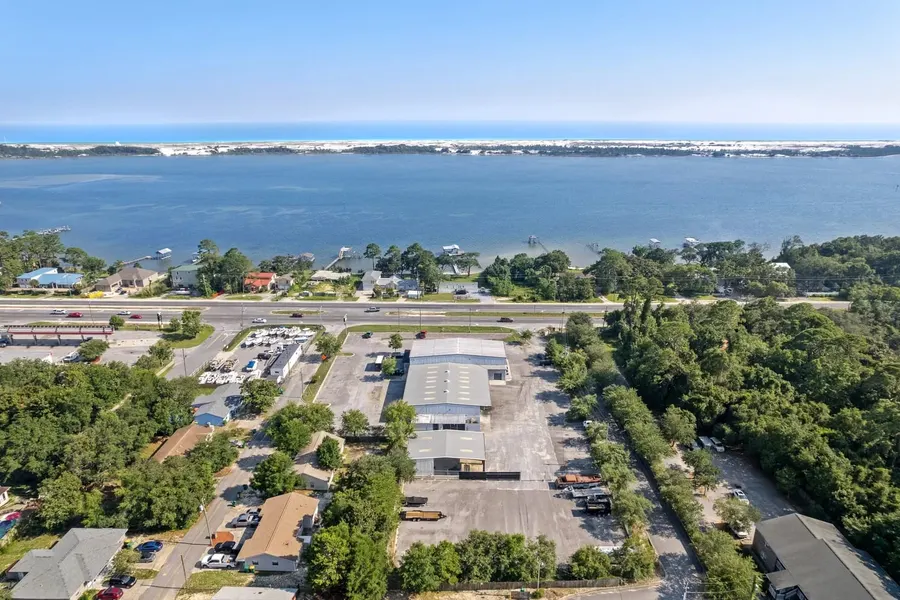 Aerial of commercial property overlooking the sound and barrier island dunes near Destin