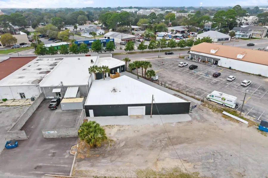 Aerial view of a Fort Walton Beach commercial building and parking lot