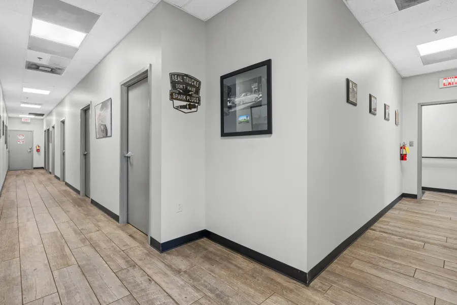 Gray office corridor decorated with vintage truck artwork