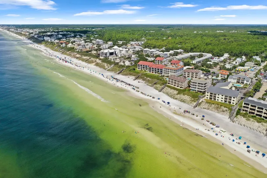 Aerial view of Emerald Coast beachfront homes and condos along white sand