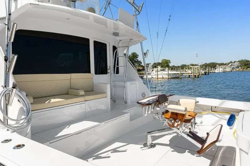 Cockpit of a sportfishing yacht with fighting chair and mezzanine seating