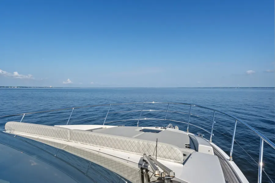 Yacht bow with quilted sun pads looking out over calm open water