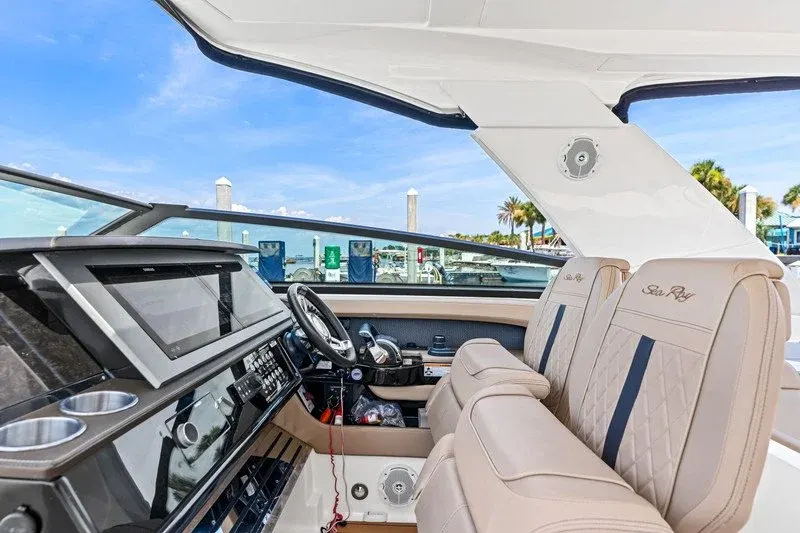 Sea Ray helm station with touchscreen display and quilted tan seats