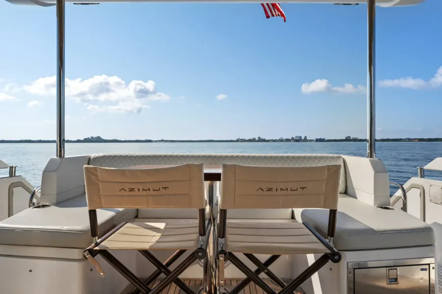 Azimut yacht aft deck seating with calm gulf waters beyond