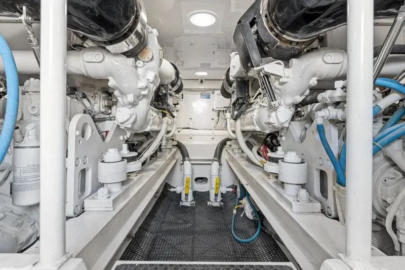 Immaculate yacht engine room with twin diesel engines and clean walkway