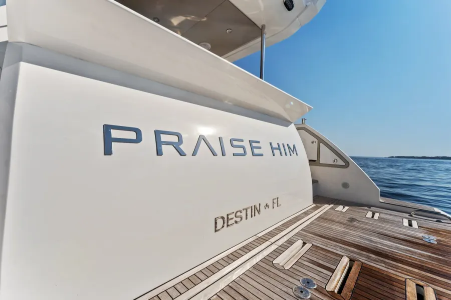 Yacht transom with Destin FL hailing port and teak swim platform